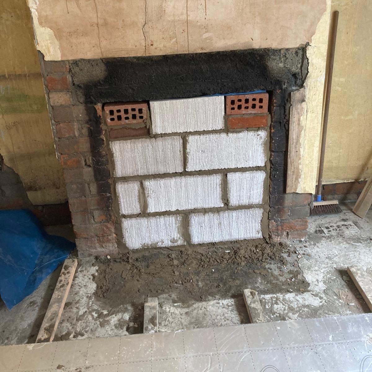 Brick fireplace opening before plastering